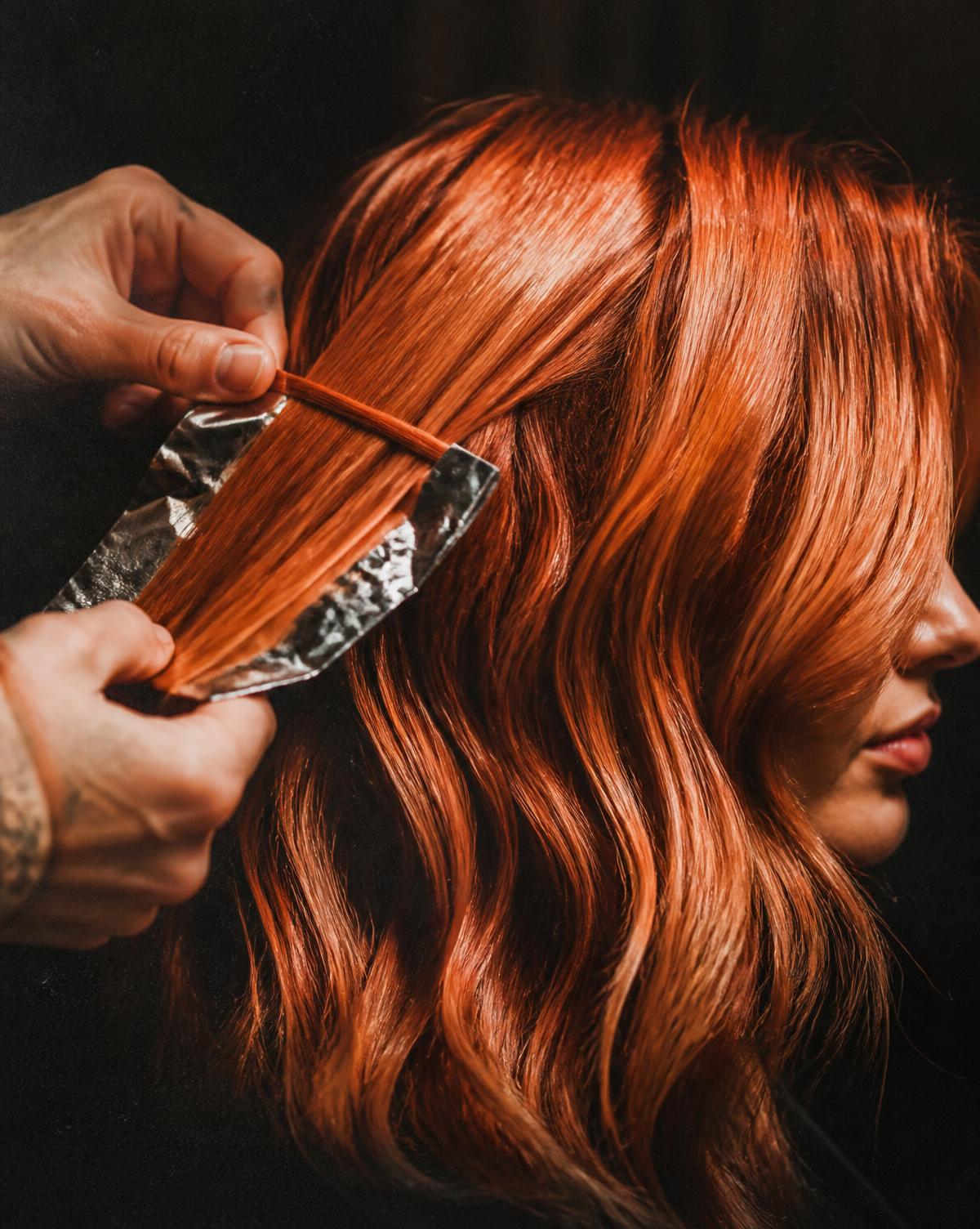 Colourist working on a vivid copper application